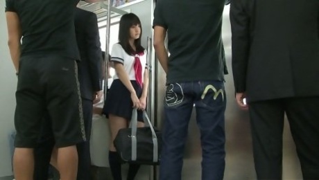 Whorish Japanese college chick Yayoi Yoshino is fucked by several dudes in the subway car